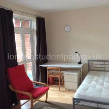 Lounge Bedroom 1-  French window to balcony overlooking Old Gloucester St..
