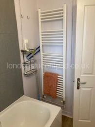 Bathroom 2 - heated towel rail & shelving unit